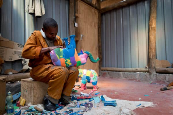 Artisan makes elephant from flip flops